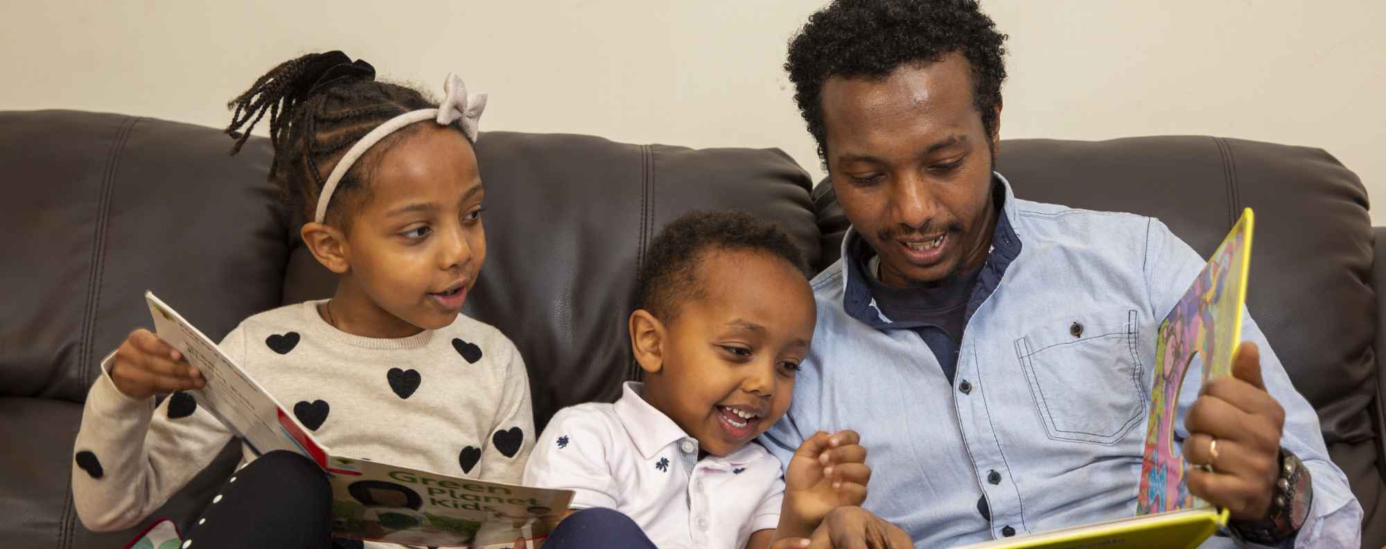 Home Satart UK Ashford volunteer mum and dad pushing triplets